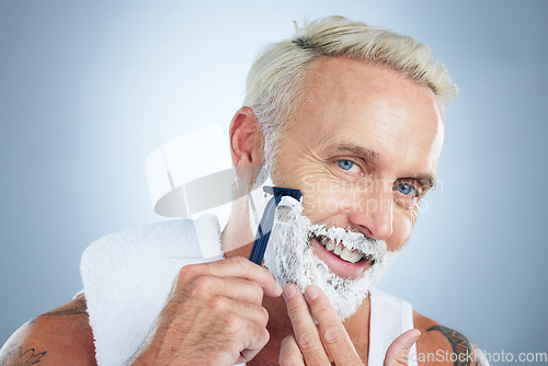 Image of Senior man, razor and shaving for skincare grooming, beard or hair removal against a studio background. Portrait of happy mature male face with shaver, cream or foam for facial treatment on mockup