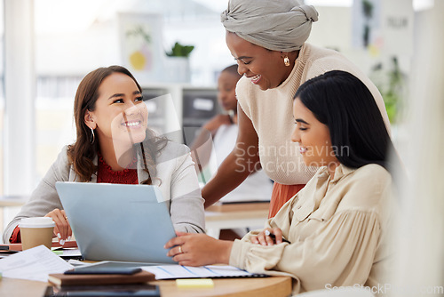 Image of Business women, diversity and laptop collaboration of a web analytics group in a office. Teamwork, solidarity and online solution of female staff in a meeting with website statistics and data