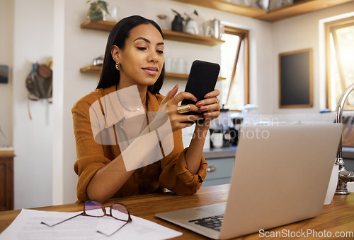 Image of Remote work, phone and texting by business woman in kitchen with laptop, documents and form. Freelance, smartphone and female checking app, website or social media while working on online proposal