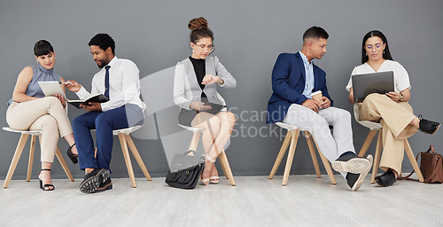 Image of Talking, waiting and business people with tech in office, checking the time and planning. Meeting, team and corporate employees busy getting ready for an interview, networking and helping with work