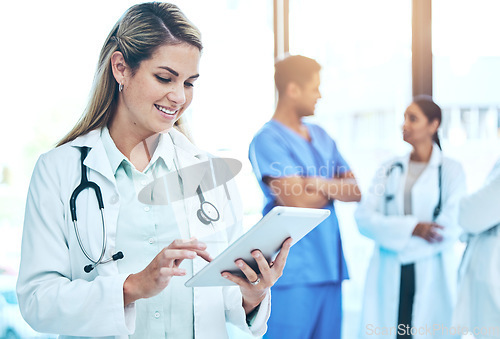 Image of Woman doctor on tablet for medical research, hospital employees management or telehealth services check. Professional healthcare worker or manager working on digital technology or clinic workflow app