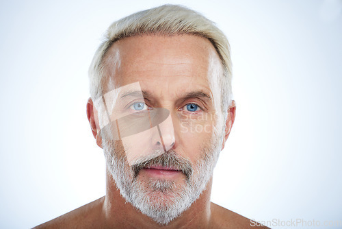 Image of Old man, face and serious with beauty and grooming, hygiene and skin isolated on studio background. Portrait, facial and mockup space with senior male, anti aging cosmetic care and dermatology