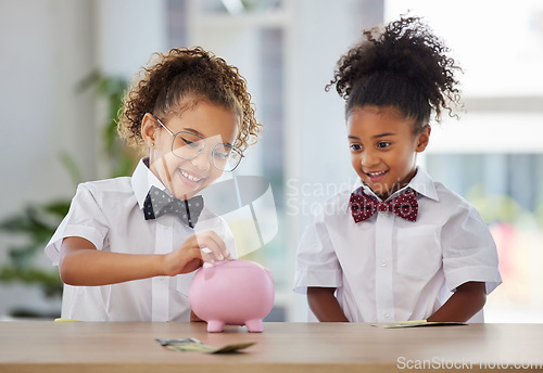 Image of Happy, saving and girls with money for a piggybank, investing coins and excited while playing. Budget, smile and little children with cash for investment, safe keeping and learning to save together