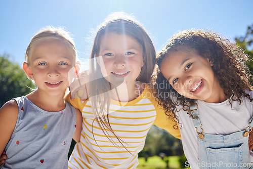 Image of Happy, friendship and portrait of children in a park playing together outdoor in nature. Happiness, diversity and girl kid friends with smile standing, embracing and bonding in a outside green garden