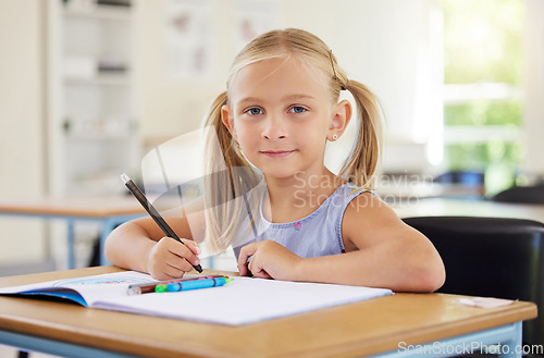 Image of Education, drawing and portrait of girl in classroom learning, exam or studying with book. Preschool, development or confident kid or student from Canada with creative art in notebook in kindergarten