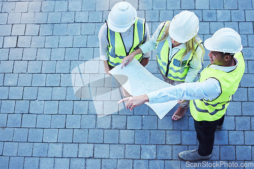 Image of Top view, team and blueprints for engineering, discussion and architecture for project, brainstorming and construction. Contractor, group and people with building plans, teamwork and planning outdoor