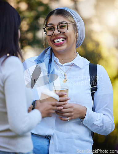 Image of Laughing, break or university friends at park on campus for learning, education or goals together. Funny girls Muslim or students relaxing with school books meeting for research or college knowledge