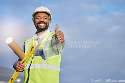 Image of Black man, architect and construction with blueprint and thumbs up, infrastructure and builder with success. Mockup, blueprint and helmet for safety, happy male contractor with agreement in portrait