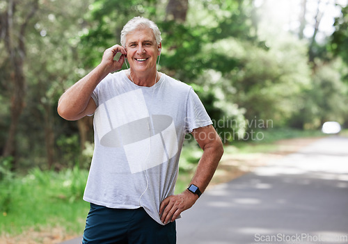 Image of Senior man, exercise and outdoor with music earphones for run, workout and training on road for fitness. Elderly male person happy about cardio audio for health and wellness or walking and running