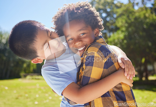 Image of Happy, children or friends hugging in park together for fun, bonding or playing in sunny summer. Portrait, diversity or excited young boy best friends smiling or embracing on school holidays outside