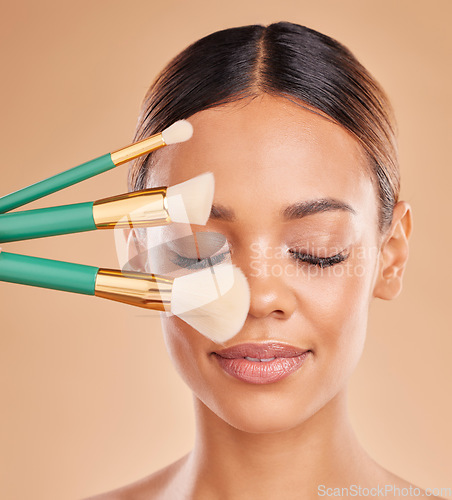 Image of Makeup brushes, eyes closed or girl with facial self care or beauty cosmetics on studio background. Face model, smile or beautiful woman marketing luxury female products or natural glowing skincare