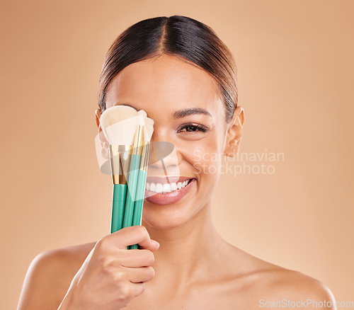 Image of Makeup brushes, portrait or happy woman with eyeshadow, facial products or self care on studio background. Face model, smile or young girl smiling with beauty cosmetics or natural glowing skincare