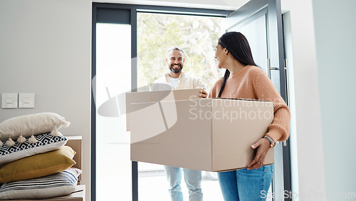 Image of Happy people moving, new house and carrying box, man and woman, real estate property and home owner. Mortgage, couple walking in front door and partnership with smile, relationship and relocation