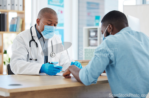 Image of Black man, doctor and mask consulting patient for healthcare prescription or covid diagnosis at hospital. African male medical professional talking to client with face masks or test results at clinic