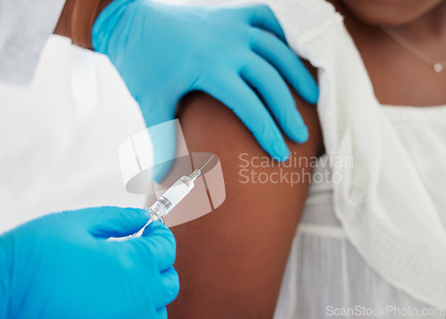 Image of Hand, covid vaccine and a patient closeup with her doctor in a hospital for an injection of medicine antibiotics. Healthcare, medical and consulting with a healthcare professional holding a syringe