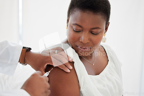 Image of Hand, covid vaccine and a black woman with her doctor in the hospital for an injection of medicine antibiotics. Healthcare, medical or consulting with a male healthcare professional holding a syringe