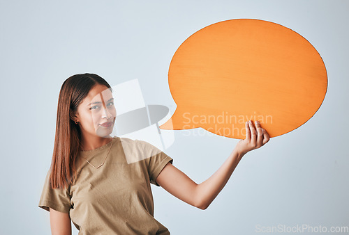 Image of Speech bubble, smile and portrait of woman in studio isolated on a white background. Social media, poster and happy girl with billboard for voice, opinion or branding, marketing or advertising space.