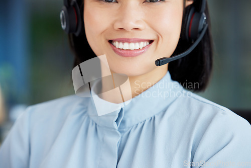 Image of Asian woman, call center employee and smile with face, communication and CRM, headset with mic and closeup. Contact us, customer service or telemarketing, happy female consultant and help desk