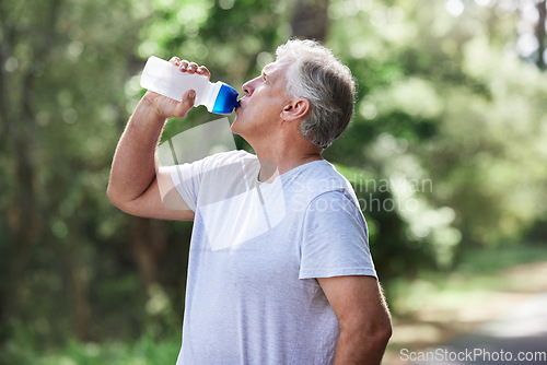 Image of Man, exercise and outdoor drinking water for a run, workout and training for fitness. Senior male person with bottle for hydration, cardio health and wellness while running in nature and retirement