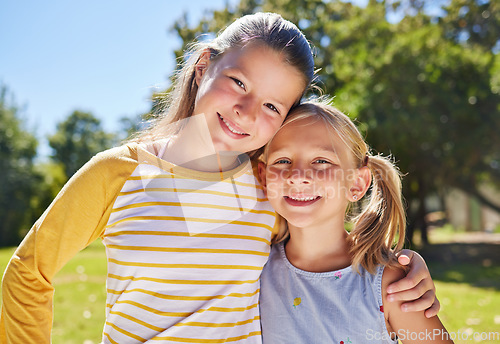 Image of Portrait, children and hug with friends in a park together for fun, bonding or playing in summer. Hugging, kids and love with girl best friends embracing in a garden in the day during school holidays