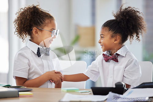 Image of Handshake, playful and girls dressed as employees, welcoming and thanking in an office. Happy, team and little children playing business, pretending to be at work and shaking hands for partnership