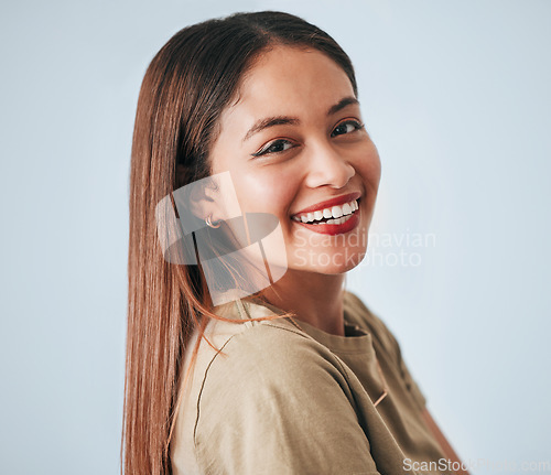 Image of Woman, smile portrait and happiness of a gen z female in a studio with gray background. Isolated, happy and freedom from a person feeling carefree, youth and confidence with laughter from motivation