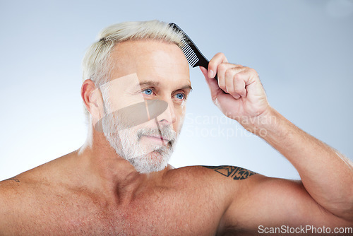 Image of Old man, comb hair and grooming, beauty and haircare with hygiene and skin isolated on studio background. Senior male, cosmetics and brushing with cosmetology, routine and hairstyle with self care