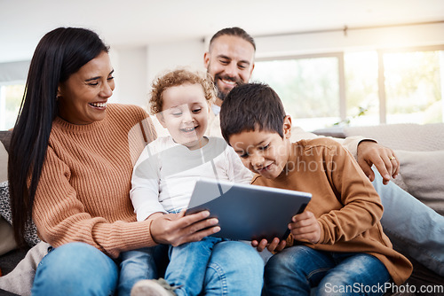 Image of Family, tablet and children learning online in the living room of home with happy parents for child development. Education, funny video or internet with a father, mother and kids bonding on the sofa