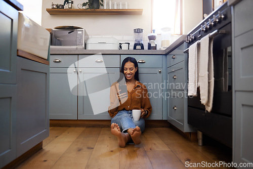 Image of Coffee, smartphone and woman on floor, kitchen and chatting on social media, texting and message. Female, connection and lady with cellphone, tea and cappuccino with network, sms and signal in home