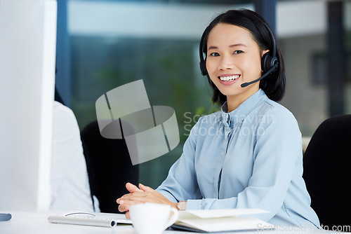 Image of Asian woman, call center employee and happy in portrait, communication and CRM, headset with mic in office. Contact us, customer service or telemarketing, female consultant with smile and help desk