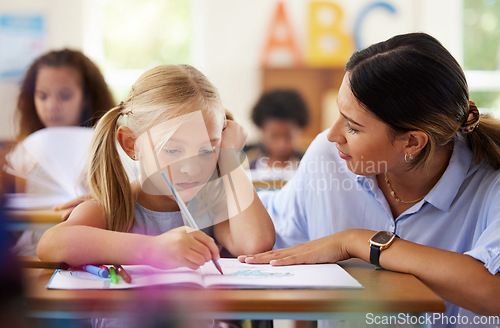 Image of Teacher, learning and sad girl drawing in classroom, studying or assessment. Teaching, development and depressed kid or unhappy student with woman helping for art education with book in kindergarten.