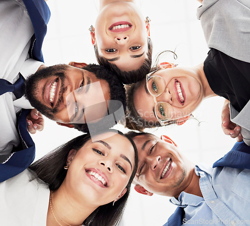 Image of Team building, support or portrait of business people in huddle for collaboration, partnership or community. Faces, low angle or happy group of workers with smile, mission goals or target together