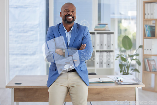 Image of Happy black man, arms crossed and mature portrait in corporate office, company about us or profile picture of CEO introduction. Smile, confident and management person with financial success mindset