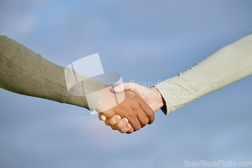 Image of Handshake, agreement and people teamwork, partnership and collaboration for support, onboarding and b2b on blue sky. Woman with partner shaking hands together for welcome, thank you or deal on mockup