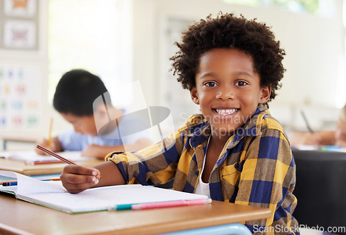 Image of Education, drawing portrait or boy child in classroom learning, exam or studying with preschool notebooks. Development or kids or happy student with creative art writing for knowledge in kindergarten