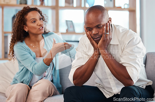 Image of Couple, fight and angry on sofa for marriage problems, conflict and bad communication. Divorce, argument and frustrated people in anger with man, woman and partner in living room for blame of affair