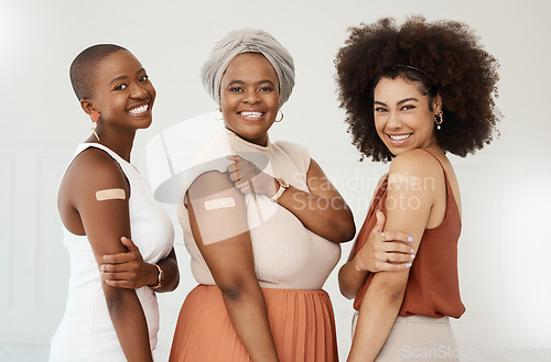 Image of Happy, portrait and women excited about vaccine isolated on a white background in a studio. Covid, plaster and corporate employees or friends together after getting vaccinated for office compliance