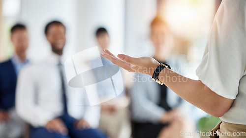 Image of Leadership, presentation and hands of a manager in a conference for a meeting or training workshop. Coaching, staff and a speaker with a speech, talking and standing with employees for a seminar
