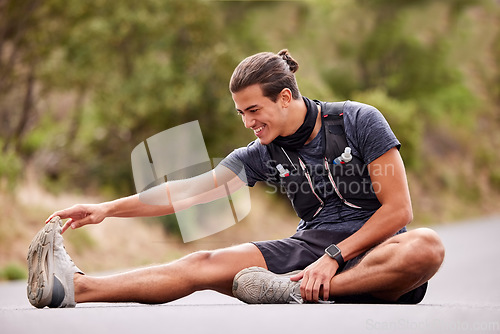 Image of Fitness, man and stretching legs for running, workout or exercise in the nature outdoors. Happy active male smile in warm up leg stretch to start sport training, run or exercising on street or road