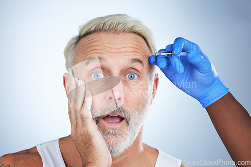 Image of Botox, wow portrait and surprise of a senior man in a studio doing plastic surgery and cosmetic skincare. Dermatology, wrinkles and anti aging treatment of a mature model with filler injection