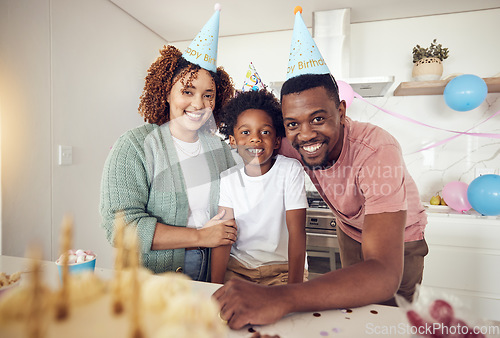 Image of Birthday, party and portrait of family in kitchen for celebration, bonding and affectionate. Happiness, excited and care with parents and child at home for surprise, fun and special event