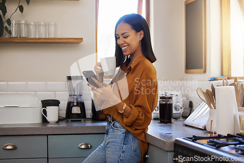 Image of Coffee break, phone and woman standing in kitchen while browsing internet, checking social media or reading email. Chat, connect and relax, resting and latino female in apartment on a break