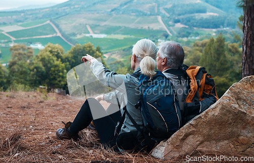 Image of Mountains, retirement and hiking, old couple pointing at mountains in view on nature walk in Peru. Travel, senior man and woman relax on mountain cliff, hike with love and health on holiday adventure