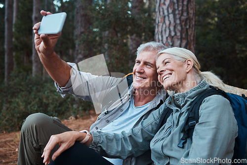 Image of Senior couple, selfie and hiking in forest, happy people in nature with memory and social media post. Smile in picture, adventure and fitness, old man and woman with active lifestyle and outdoor