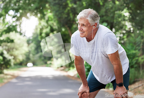 Image of Senior man, outdoor and rest with music earphones for run, workout and training on road for fitness. Elderly male person happy and tired of cardio for health and wellness with audio for running