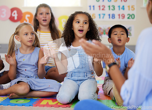 Image of Teacher, singing or kids in classroom learning a song together in preschool for voice development. Children daycare, vocal or young students in poem or musical performance in kindergarten creche