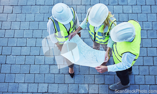 Image of Top view, construction and team with blueprint, engineer and collaboration for new project, talking and planning. Staff, architecture or discussion with document, share ideas or brainstorming outdoor