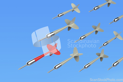 Image of Many flying darts against blue sky