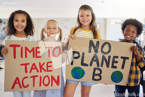 Image of Children, portrait and poster with friends in protest in a classroom holding signs for eco friendly activism. Kids, green and sign with a child group standing together for community or ecology