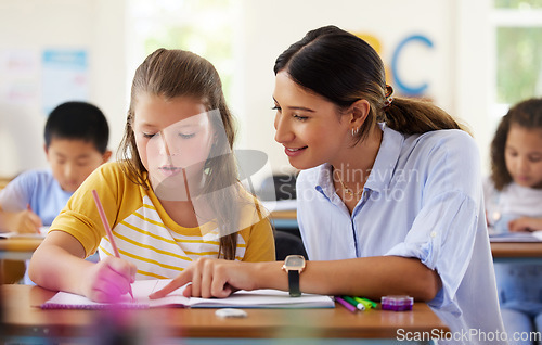 Image of Teacher, learning and helping girl in classroom for writing, studying or assessment. Teaching, development and kid or student with happy woman for education assistance with notebook in kindergarten.